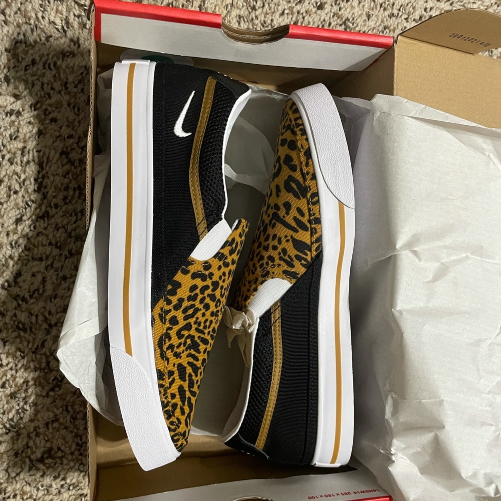 Brand new women’s slip on leopard Nike shoes. Size 8